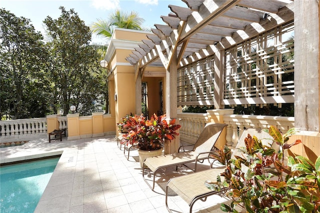 view of patio / terrace featuring a swimming pool and a pergola