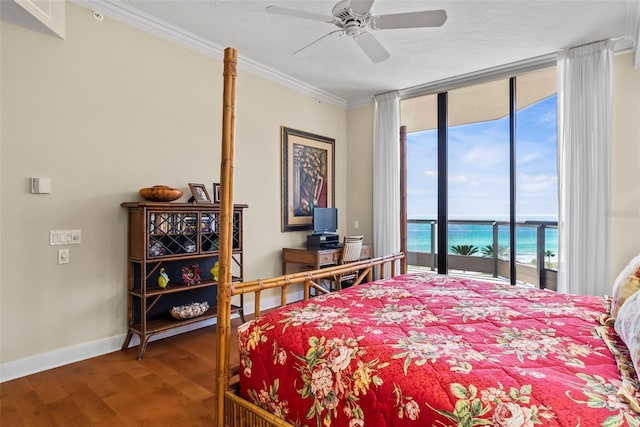 bedroom featuring hardwood / wood-style flooring, ornamental molding, access to outside, ceiling fan, and floor to ceiling windows