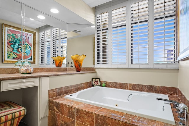 bathroom featuring a relaxing tiled tub