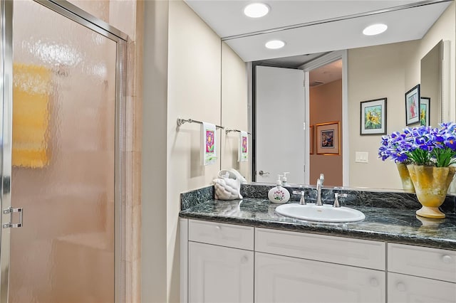 bathroom featuring vanity and walk in shower