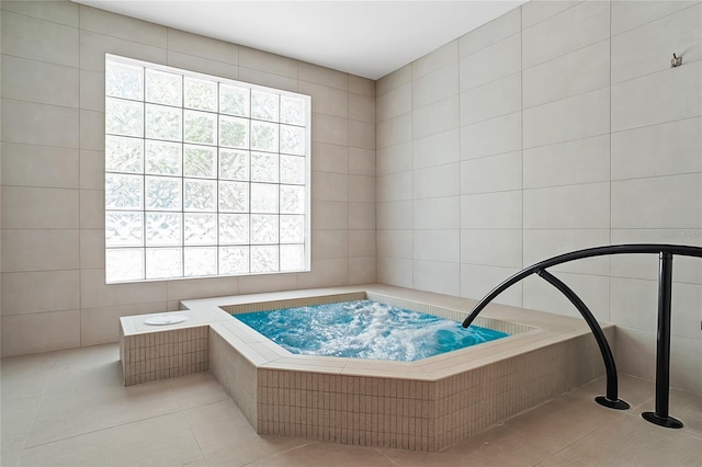 bathroom featuring tile patterned flooring and tile walls