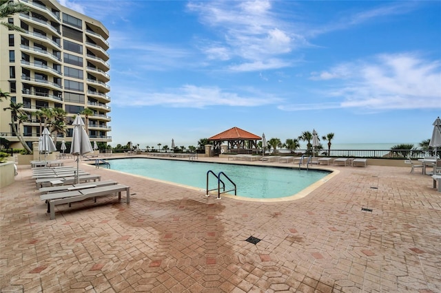 view of swimming pool with a gazebo and a patio area