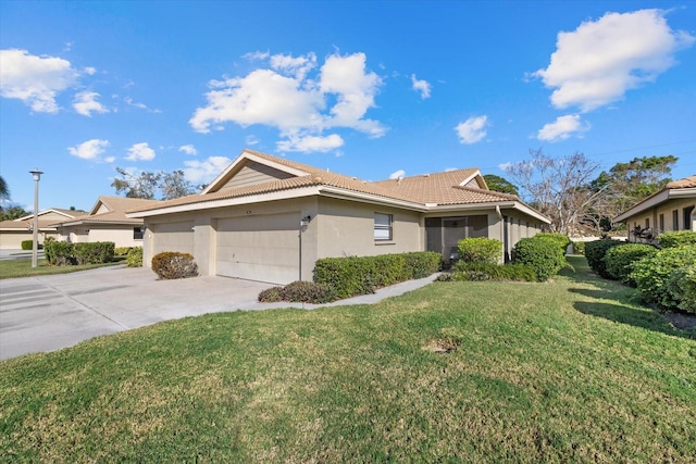 view of front of home featuring a garage and a front yard