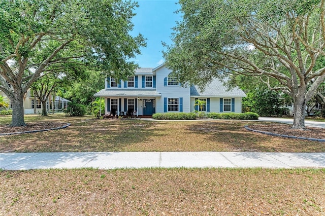 colonial-style house with a front yard