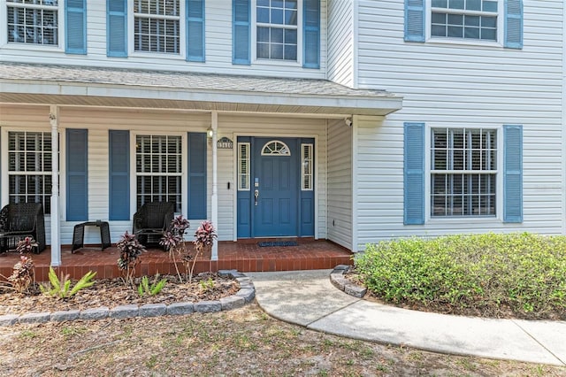 property entrance with covered porch