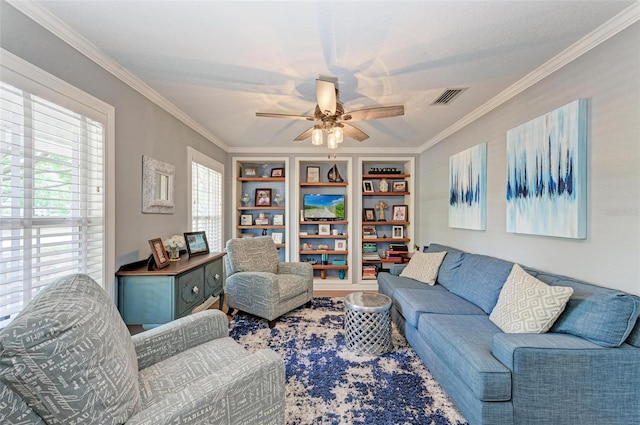 living room with crown molding and ceiling fan