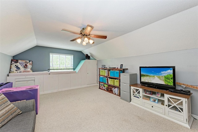 game room with light carpet, lofted ceiling, a textured ceiling, and ceiling fan