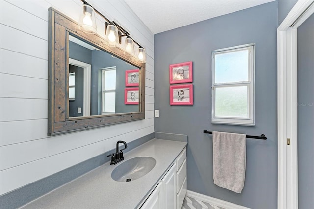 bathroom featuring vanity and a textured ceiling