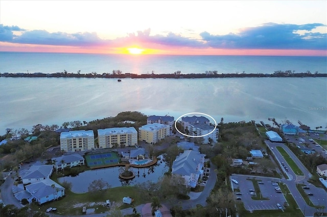 aerial view at dusk with a water view