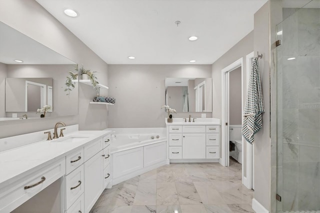 full bathroom featuring vanity, toilet, and independent shower and bath