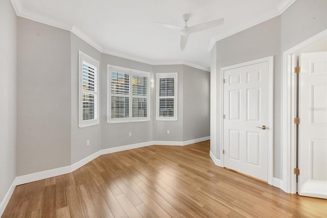 unfurnished bedroom featuring light wood-type flooring, ceiling fan, and ornamental molding