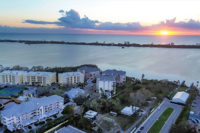 aerial view at dusk with a water view