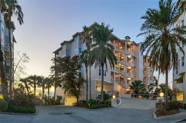 view of outdoor building at dusk