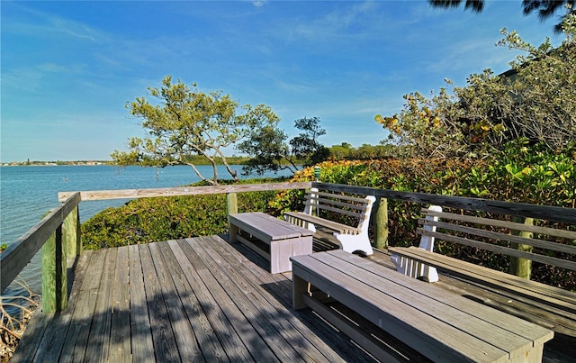 wooden deck with a water view