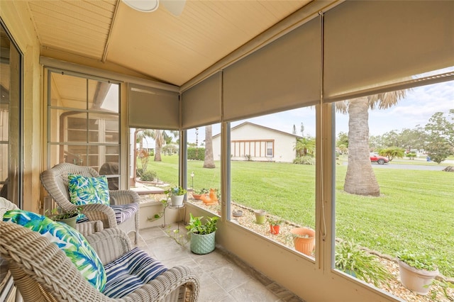 sunroom with lofted ceiling and wooden ceiling