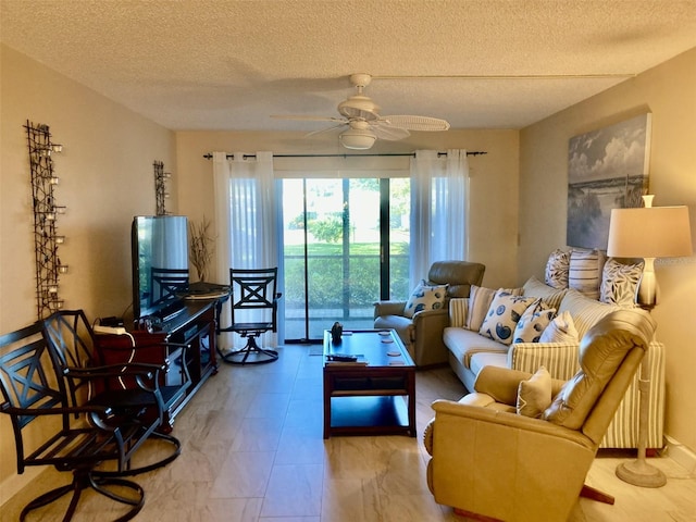 living room with a textured ceiling and ceiling fan