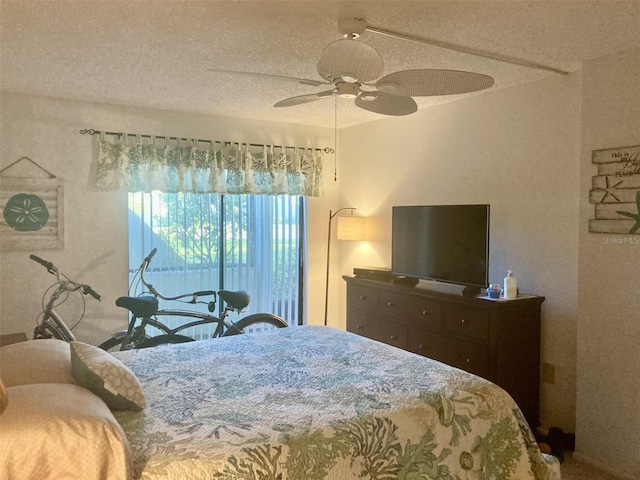 bedroom featuring a textured ceiling and ceiling fan