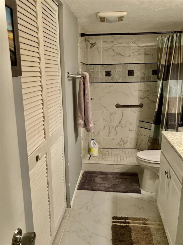 bathroom featuring vanity, a shower with curtain, and toilet