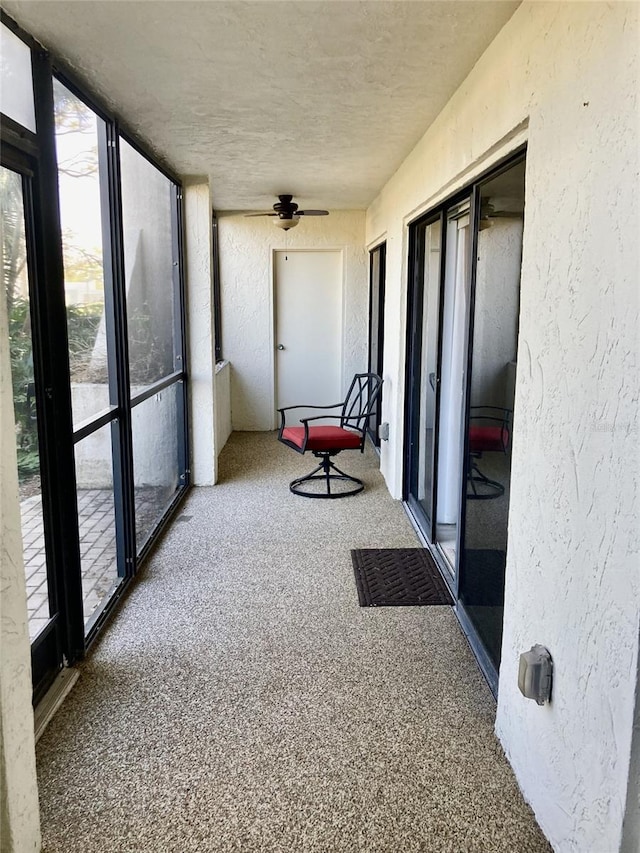 sunroom / solarium with ceiling fan