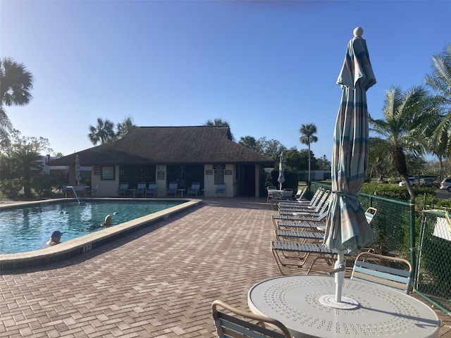 view of swimming pool with a patio