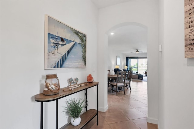 hall featuring light tile patterned flooring