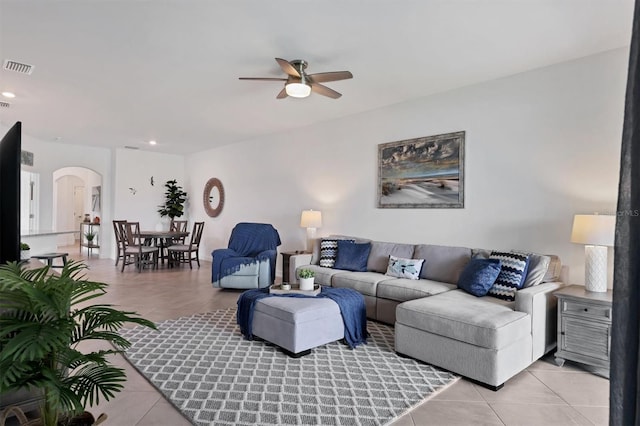 living room featuring ceiling fan and light tile patterned floors