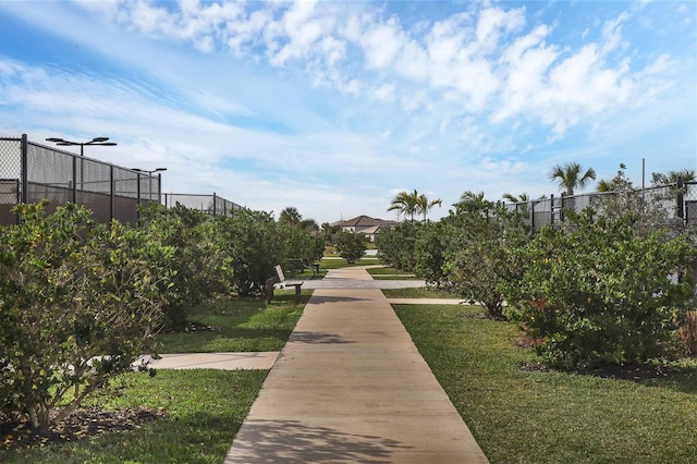 view of home's community with a lawn