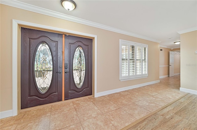 foyer entrance with french doors, light wood-type flooring, and ornamental molding