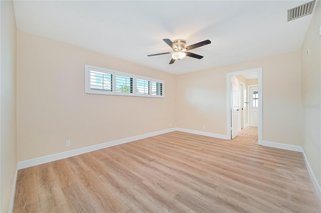 unfurnished room featuring ceiling fan and light wood-type flooring