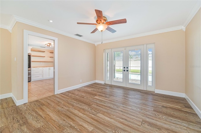 unfurnished room featuring ceiling fan, light hardwood / wood-style floors, crown molding, and french doors