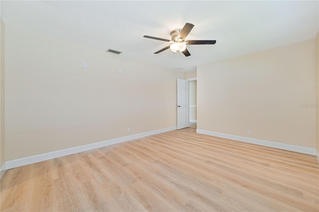 empty room featuring ceiling fan and light wood-type flooring