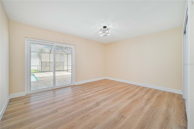 unfurnished room with light hardwood / wood-style flooring