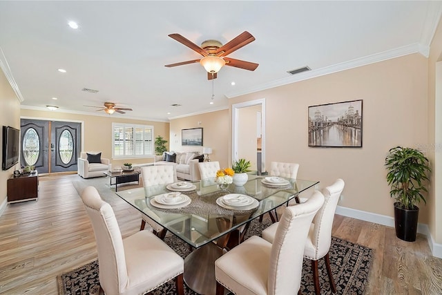 dining area with ornamental molding, light hardwood / wood-style floors, and ceiling fan