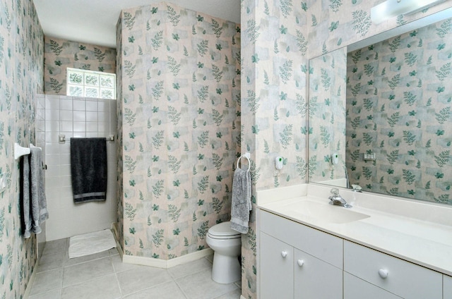 bathroom with vanity, toilet, and tile patterned flooring