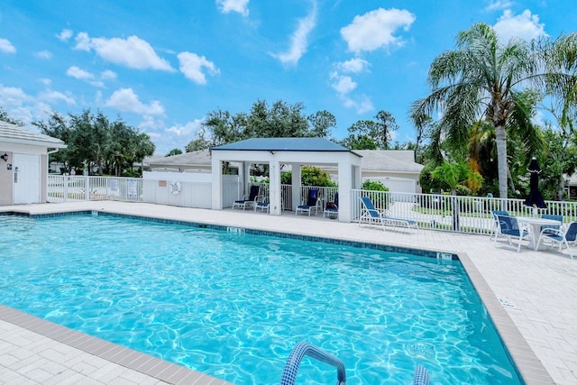 view of swimming pool featuring a patio