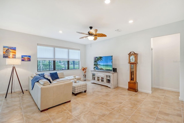 living room featuring light tile patterned floors and ceiling fan