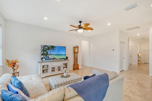 tiled living room featuring ceiling fan