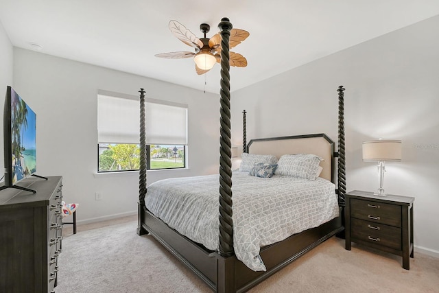 bedroom with ceiling fan and light colored carpet