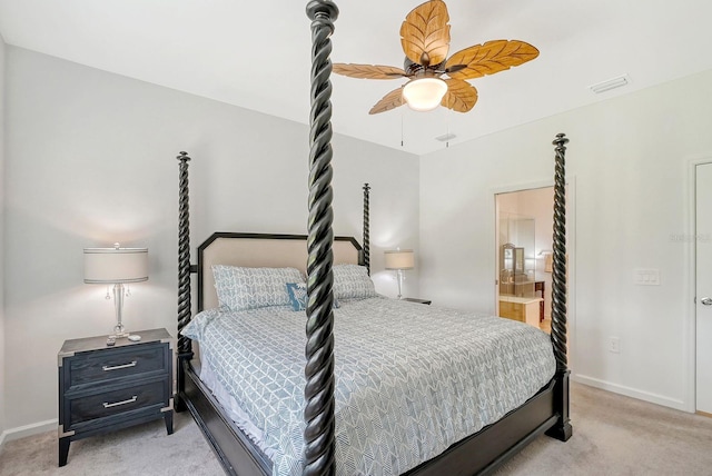 carpeted bedroom featuring ceiling fan and ensuite bathroom