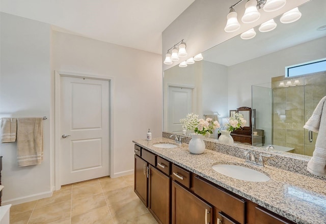 bathroom with tile patterned flooring, vanity, and a shower with shower door