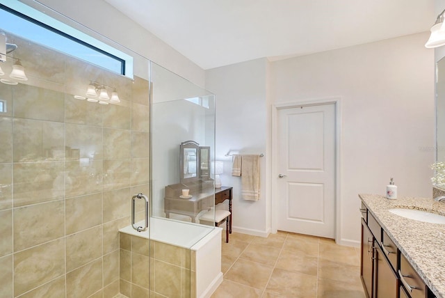 bathroom with vanity, tile patterned floors, and a shower with door