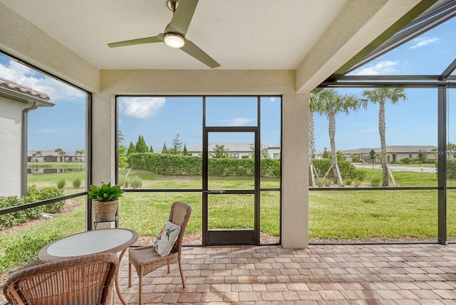 sunroom / solarium with ceiling fan