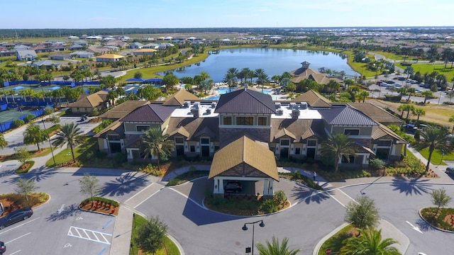 birds eye view of property with a water view