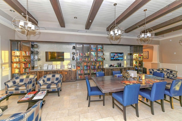 dining space with beamed ceiling, a chandelier, light tile patterned floors, and ornamental molding