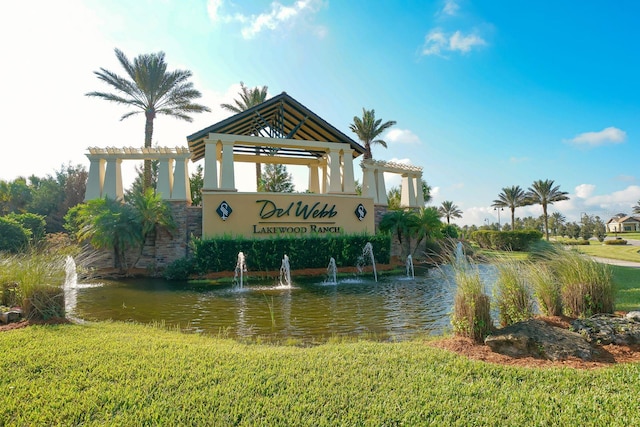 community sign with a water view