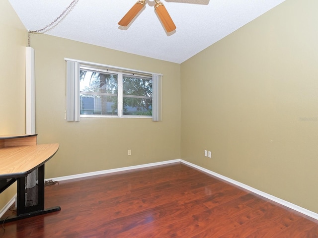 interior space with hardwood / wood-style floors, ceiling fan, a textured ceiling, and vaulted ceiling