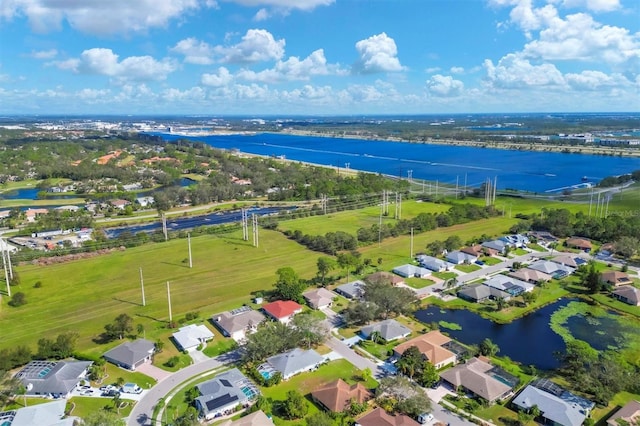 birds eye view of property with a water view