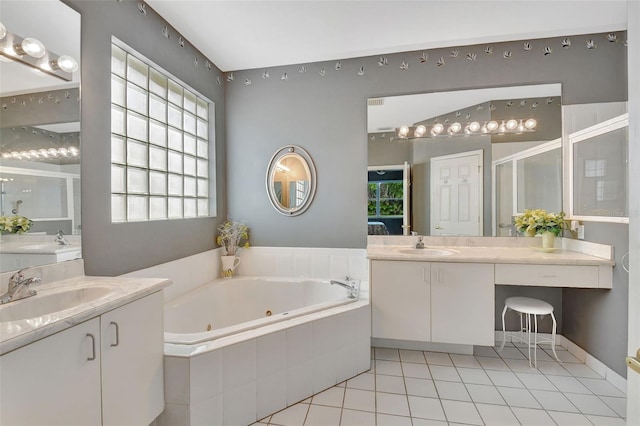 bathroom with vanity, plus walk in shower, tile patterned floors, and a healthy amount of sunlight