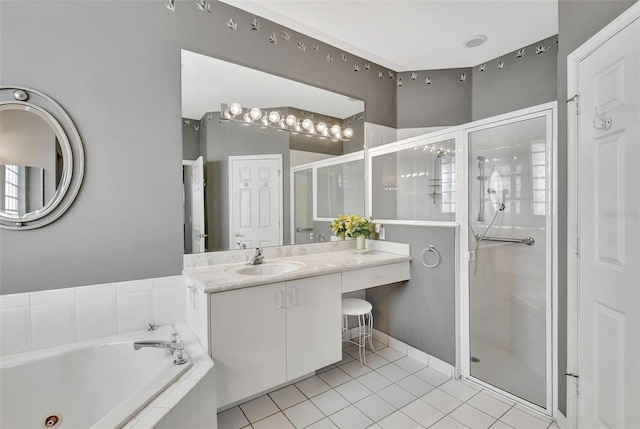 bathroom featuring vanity, tile patterned floors, and plus walk in shower