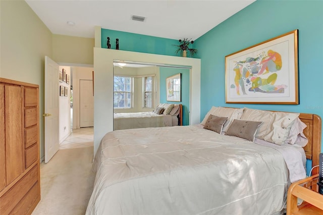 carpeted bedroom with a closet